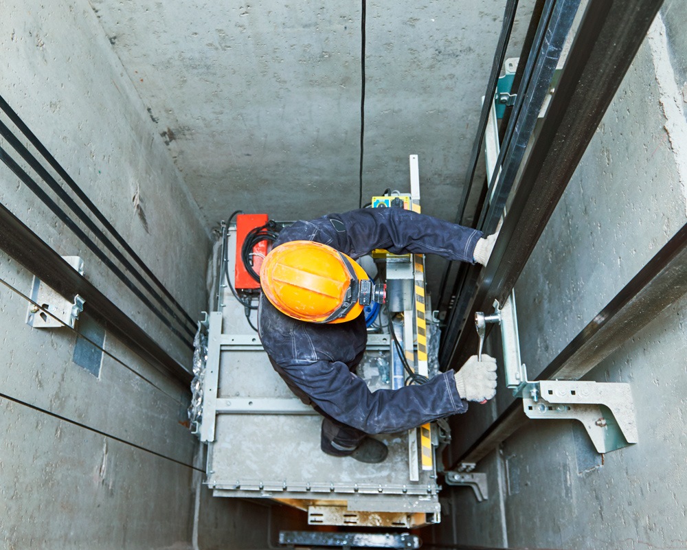 a photo of a lift service specialist at work