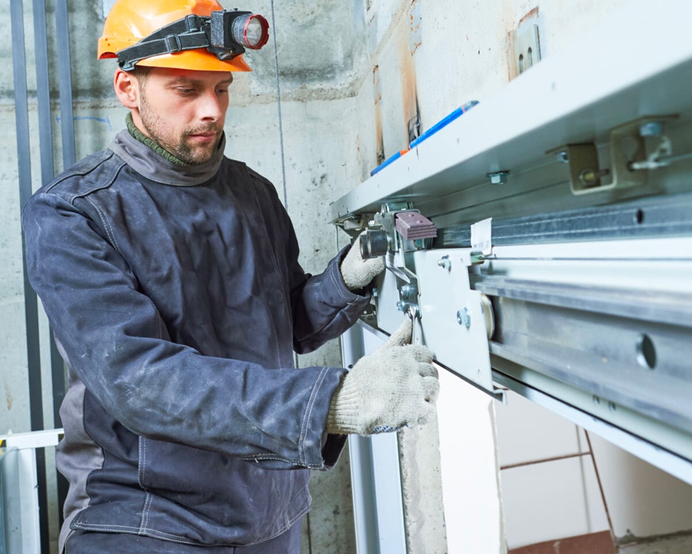a photo of a lift service specialist at work