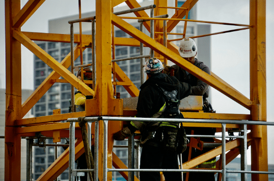 lift technicians working on an external lift shaft