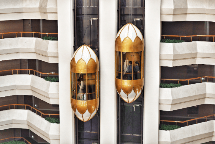 a set of two individualised elevators working on an external facade