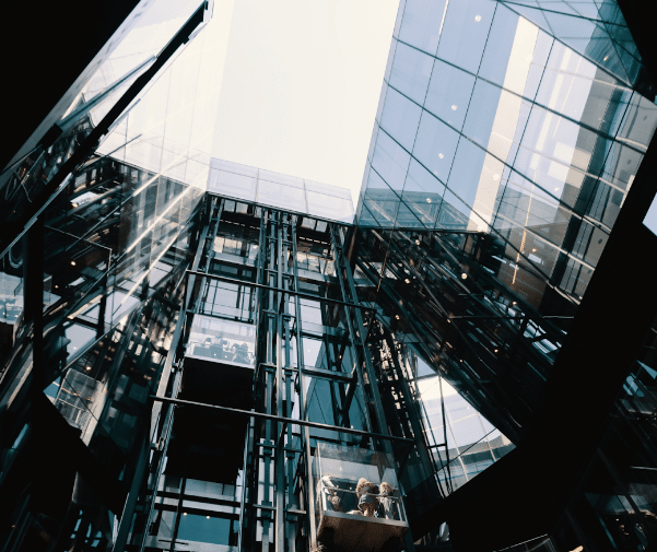 an image of a glass-panelled lift in an commercial bulding