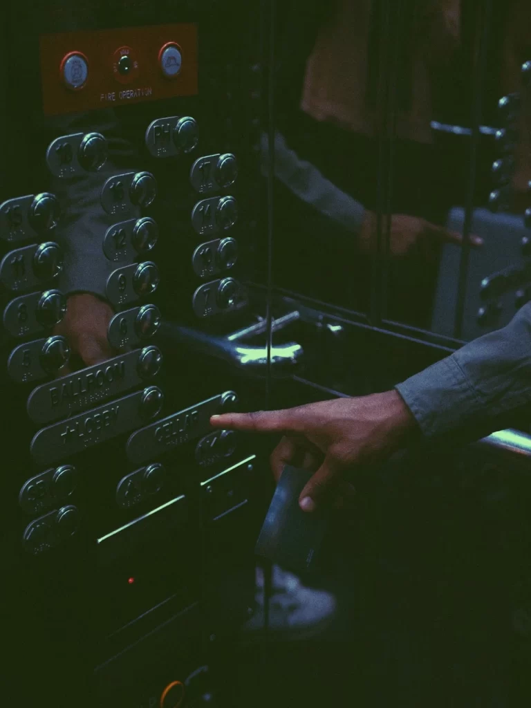 elevator buttons being pushed