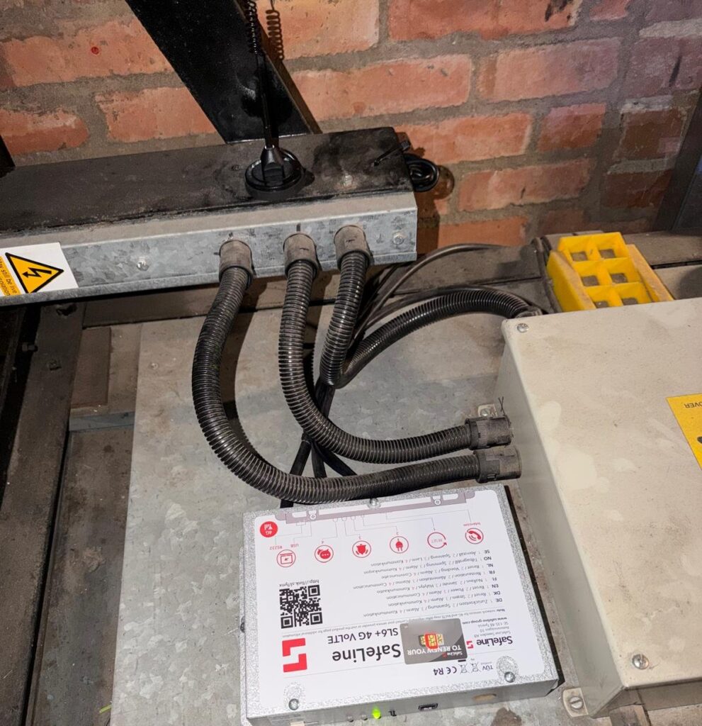 Lift emergency phone: a SafeLine SL6+ 4G all-in-one auto dialler we fitted, with its mobile aerial mounted above