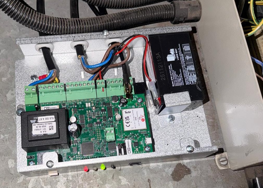 Lift emergency phone battery backup: inside a SafeLine all-in-one auto dialler we fitted, with the backup battery beside the circuit board